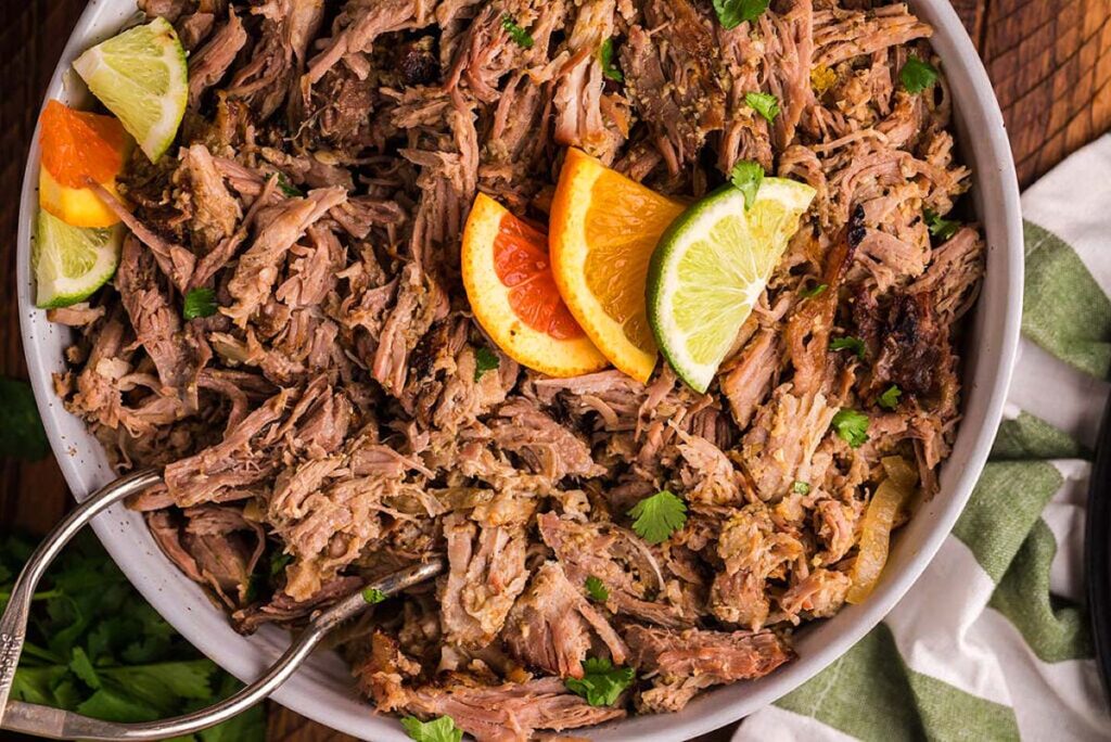 Overhead view of a large bowl of smoked pulled pork.